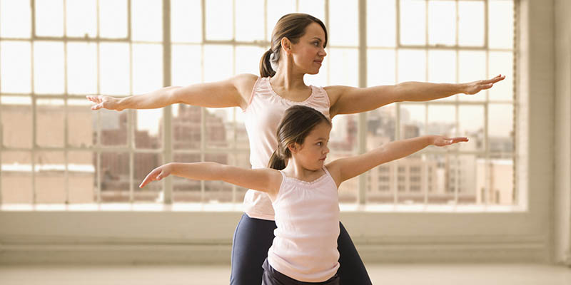 Mom and Daughter Exercising