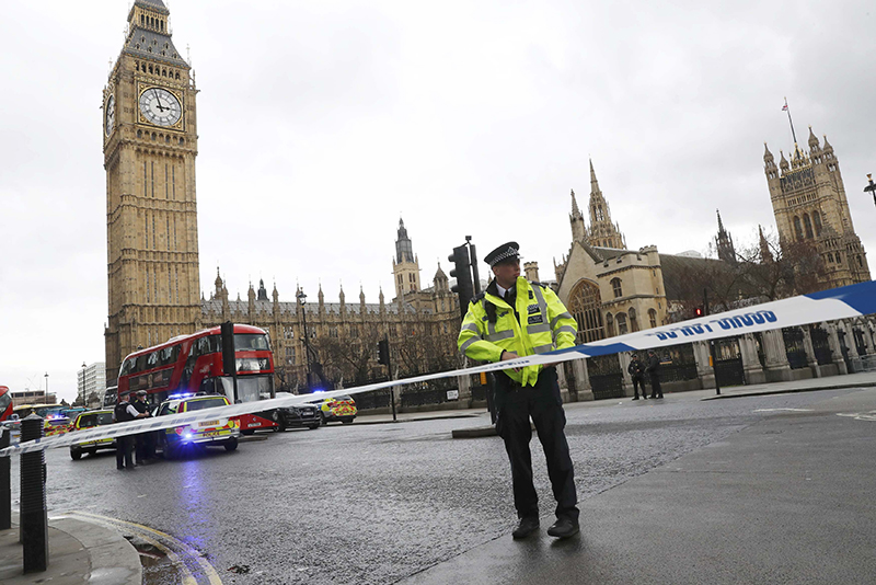 Police tapes off Parliament Square after reports of loud bangs, in London, Britain, March 22, 2017. REUTERS/Stefan Wermuth